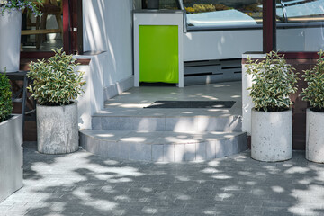 ceramic tiled entrance doorstep shop entrance by pedestrian pavement of granite brick tiles and...