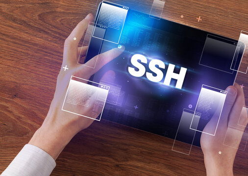 Close-up of a hand holding tablet