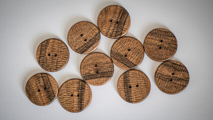 wallpaper walnut wooden buttons with a pronounced handmade texture