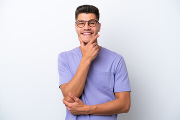 Fototapeta premium Young caucasian man isolated on white background happy and smiling