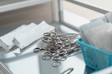 Surgical instruments such as forceps arranged on table for surgery