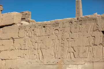 Different hieroglyphs on the walls and columns in the Karnak temple. Karnak temple is the largest complex in ancient Egypt.