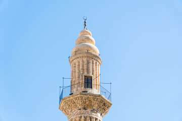 Ulu Mosque minaret in Mardin Turkey. Historic landmarks of Mardin Turkey. Old mosque minaret and sky copy space for text