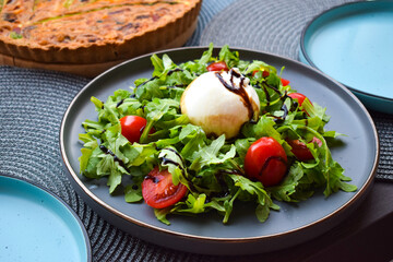 Burrata Salad with Cherry Tomatoes, Rucola and Balsamic Creme.