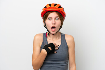Young cyclist English woman isolated on white background surprised and shocked while looking right