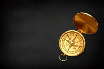 Vintage compass with copy space on a black background