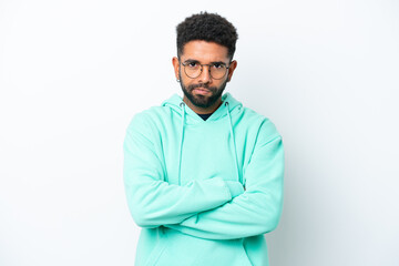 Young Brazilian man isolated on white background with unhappy expression