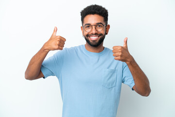 Fototapeta premium Young Brazilian man isolated on white background giving a thumbs up gesture