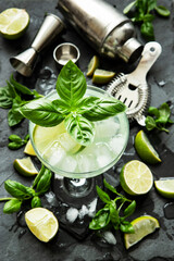 Summer cocktail with  basil in glass, selective focus