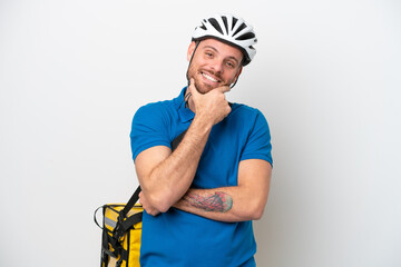 Young brazilian man with thermal backpack isolated on white background smiling