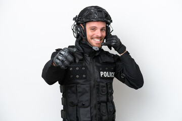 Fototapeta premium Brazilian soldier man isolated on white background making phone gesture and pointing front