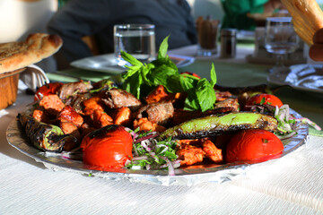Kebab, one of Turkey's famous local dishes, is served to the customer with cold onions and salad, mixed Turkish kebab.