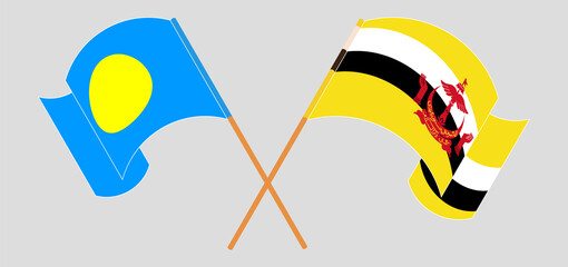 Crossed and waving flags of Palau and Brunei
