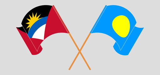 Crossed and waving flags of Antigua and Barbuda and Palau