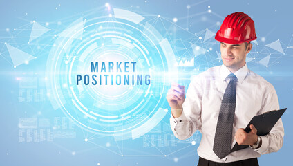 Handsome businessman with helmet drawing