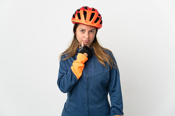 Middle age cyclist woman isolated on white background thinking