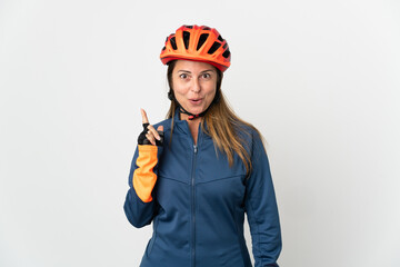 Middle age cyclist woman isolated on white background intending to realizes the solution while lifting a finger up