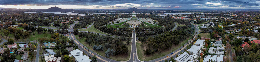 Aerial panoramic shot of Canberra in the ACT Australia, with Parlaiment house in the centre of the frame - obrazy, fototapety, plakaty