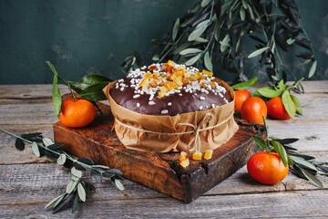 Traditional Italian Panettone Cioccolate cake stuffed with glanced fruits and raisins and chocolate...