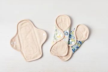 Foto op Canvas Zero waste periods kit. Eco friendly feminine hygiene, reuse concept. Reusable sanitary pads for personal hygiene. Waste-free lifestyle. © netrun78