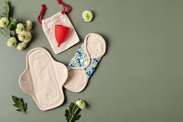Foto op Canvas Zero waste periods kit. Eco friendly feminine hygiene, reuse concept. Reusable sanitary pads and menstrual cup for personal hygiene. Waste-free lifestyle. © netrun78