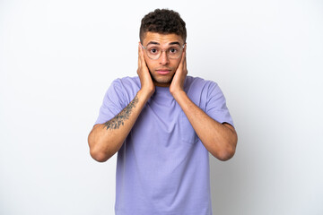Young caucasian Brazilian man isolated on white background frustrated and covering ears