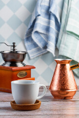 coffee in a bronze turk on the table