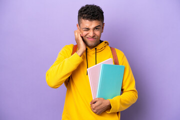 Young student Brazilian man isolated on purple background frustrated and covering ears