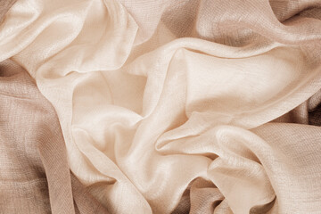 Cream beige fabric background, cloth texture close-up