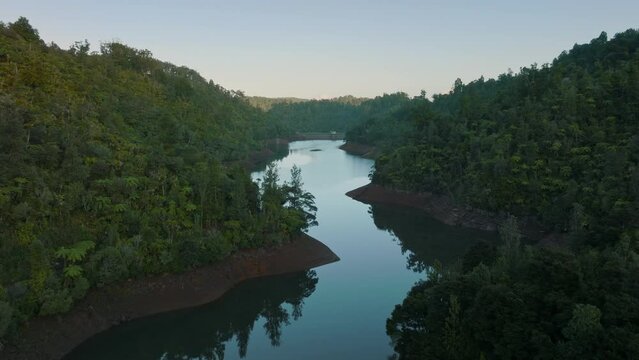 Aerial: Beautiful reservoir lake and rainforest, New Zealand