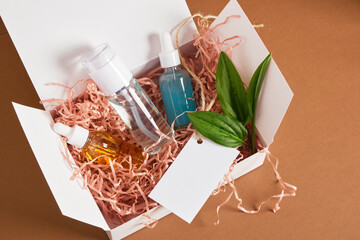 set of cosmetics and body care products in box with paper filler, gift or delivery, natural cosmetics, CO2 neutral