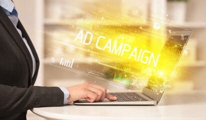 Closeup of businessman hands working on laptop