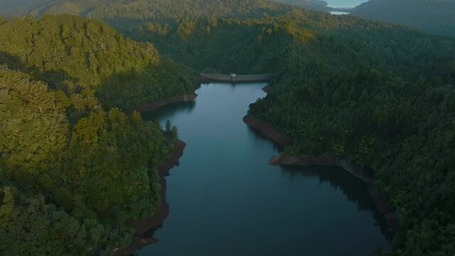 Aerial: Beautiful reservoir lake and rainforest, New Zealand