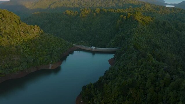 Aerial: Beautiful reservoir lake and rainforest, New Zealand