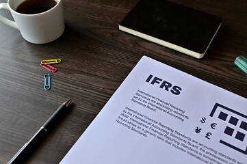 There is dummy documents that created for the photo shoot on the desk about IFRS.