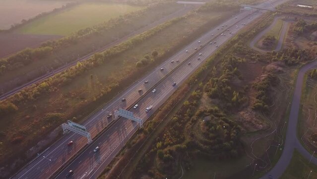 Aerial drone footage of traffic on a motorway in England.
A2 highway in Kent, UK.