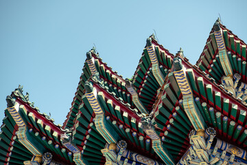 Close up on the roof decoration of the traditional Chinese temple on Tianmen mountain, Zhangjiajie,...