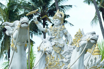 Low Angle Front View Krishna Chakra Statue With With Horses Statue In Park