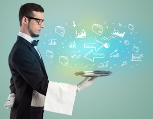 Handsome young waiter in tuxedo holding money icons on tray