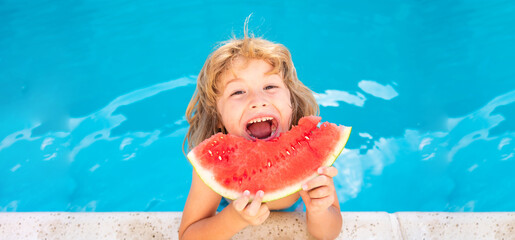 Child eating watermelon near swimming pool during summer holidays. Kids eat fruit outdoors. Healthy...
