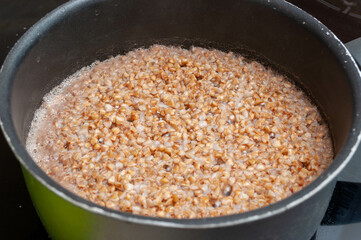 Photograph of some chickpeas soaking in a pressure cooker