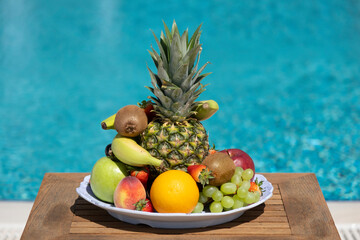 Delicious fruit plate by the pool