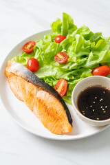 grilled salmon fillet steak with salad