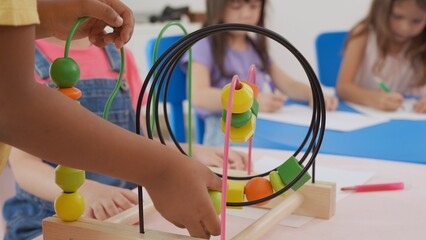 Back to school and summer course. Little children learning kindergarten classroom.