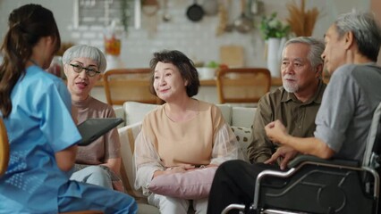 happiness Cheerful elderly woman and men talking with female caregiver nurse doctor having health checking consult at living area,Caretakers with senior couple sitting in living room at nursing home  - Powered by Adobe