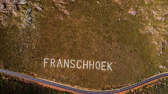 Place name on mountainside laid out with white rocks, Franschhoek; aerial
