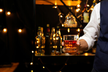 Bartender pouring Whiskey, on  bar,