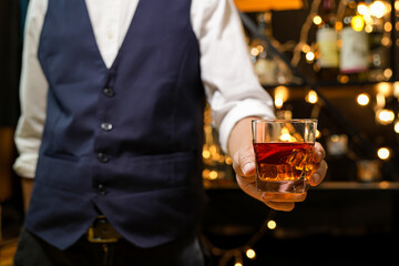 Bartender pouring Whiskey, on  bar,