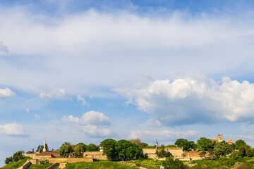 White clouds in the blue sky above the Kalemegdan Fortress on a beautiful sunny day. Background. Belgrade, Serbia.