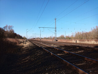 Fototapeta na wymiar Railway tracks with shadows and sunlight in Germany